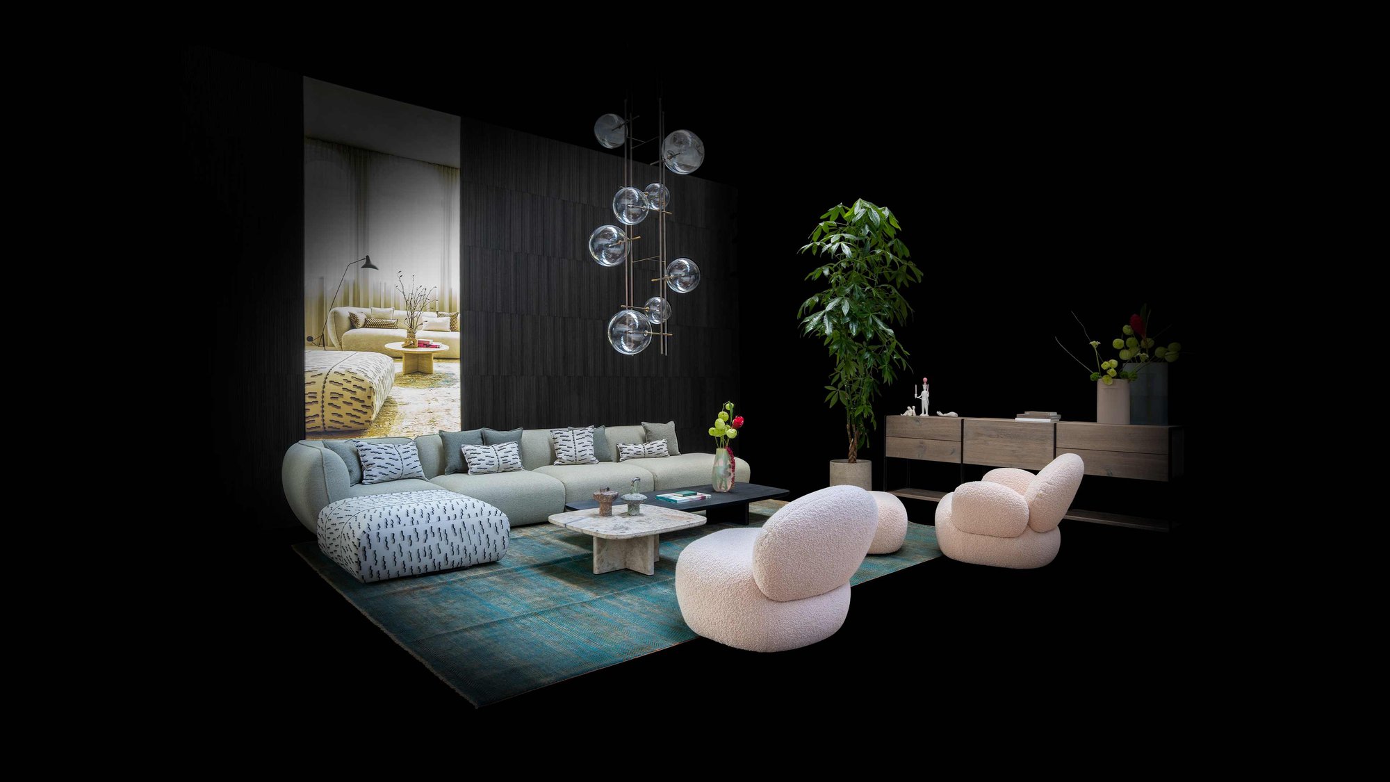 JANUA Wohnbereich mit Sofa, Sesseln und Sideboard bei der Hausmesse in Peiting bei Schotten & Hansen